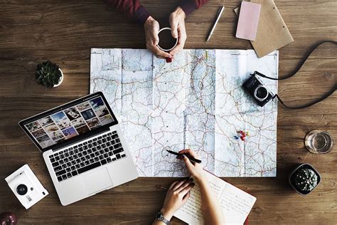 A Map Camera And Notebook With The Title Planning A Trip Travel