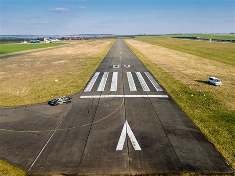 A Police Car Parked On Top Of An Airport Tarmac