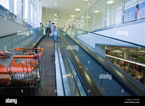 A Sainsbury S Shopping Trolley Going Up A Travelator At A Sainsbury