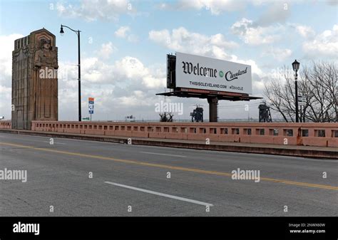 A Welcome To Cleveland Sign Near A Guardian Of Traffic Art Deco Style