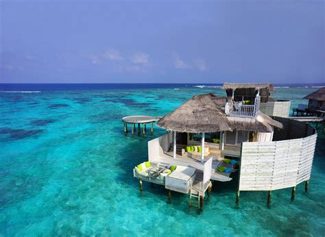 An Aerial View Of Overwater Resort In The Middle Of The Ocean With