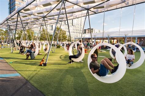 An Artist S Rendering Of People Sitting On Swings In A Park With Blue