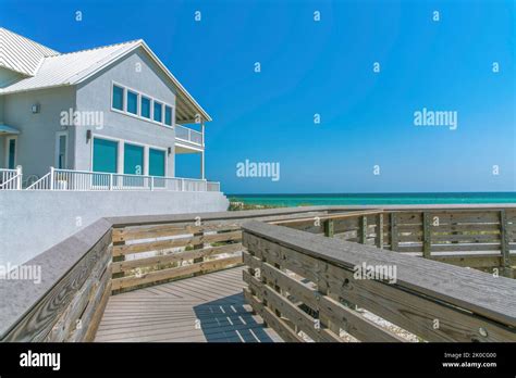 Beach House View From A Boardwalk On A Beach At Destin Florida Wooden Boardwalk With A View Of