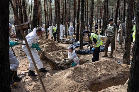 Bodies Found In Makeshift Burial In Ukraine Show Signs Of Torture