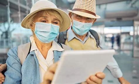 Couple In Airport Travellers Travel Medical Insurance