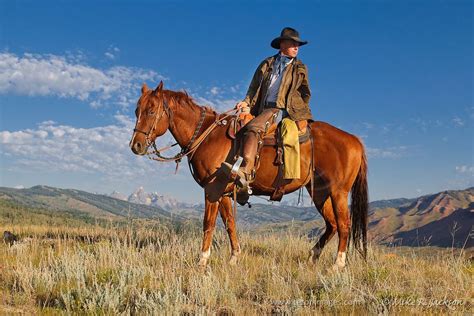 Cowboys And Wranglers In The Modern Day Wild West Mounted On A Horse