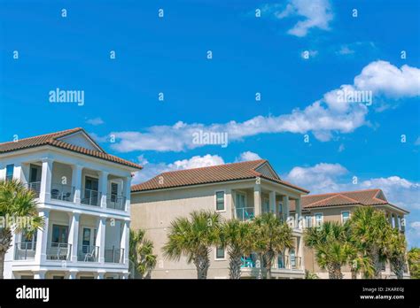 Destin Florida Beach Houses With Balconies And Palm Trees At The Front Stock Photo Image Of