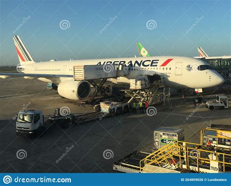 Ground Crew Loading Air France Plane With Cargo In Paris France