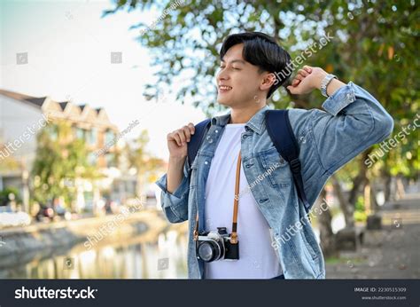 Happy Relaxed Young Asian Male Traveler Stock Photo 2230515309