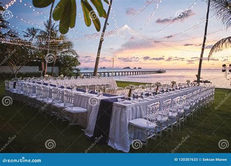 Image Of A Wedding Reception Set Up At The Beach With Palm Trees Text