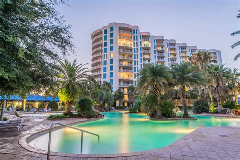 Lovely Palms Of Destin Lagoon Pool Lit Up At Night Destin Resorts Destin Florida Beach Resorts