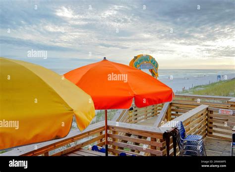 Pompano Joe Amp 39 S Restaurant And Bar Beach Entrance With Bright Umbrella Tables At Miramar Beach