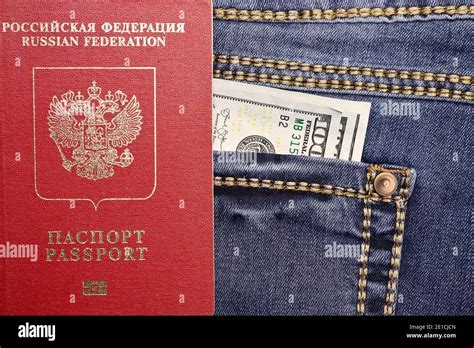 Premium Photo Passport With Hundred Dollar Bills In The Back Pocket