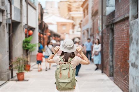 Premium Photo Woman Traveler Visiting In Taiwan Tourist With Hat And Backpack Sightseeing In