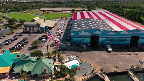 Premium Stock Video Sliding Right Aerial View Of Legendary Marine In Destin Florida With The