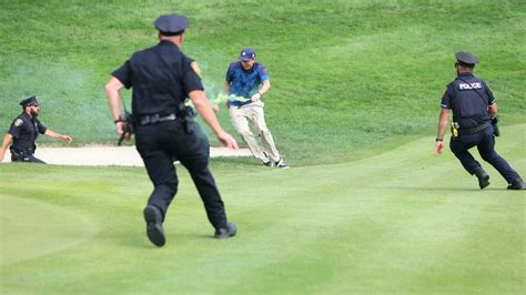 Protesters Disrupt Travelers Championship By Running Onto 18Th Green