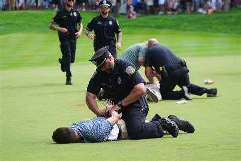 Protesters Storm The 18Th Green During Final Round Of The Pga Travelers