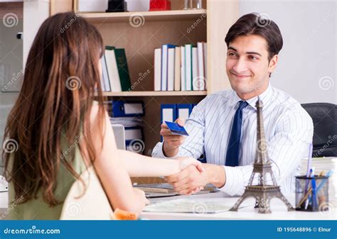 The Male Travel Agent With Customer In Agency Stock Photo Image Of