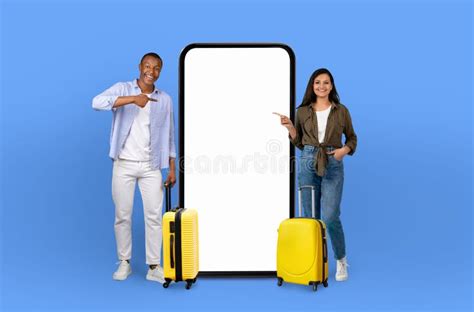 Travel Companions With Oversized Phone And Luggage Stock Photo Image