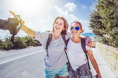 Two Young Beautiful Women Friends And Bloggers Travel Together Stock Image Image Of Camera