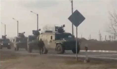 Ukrainian Fearlessly Runs In Front Of Russian Convoy To Block Advance