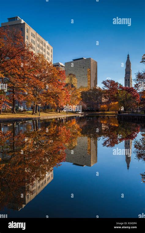 Usa Connecticut Hartford Bushnell Park Reflection Of Office Buildings And Travelers Tower