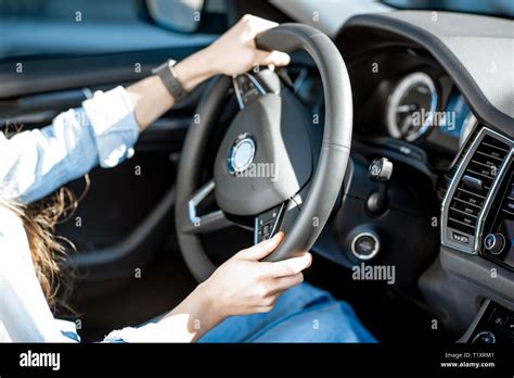 Woman Holding Steering Wheel