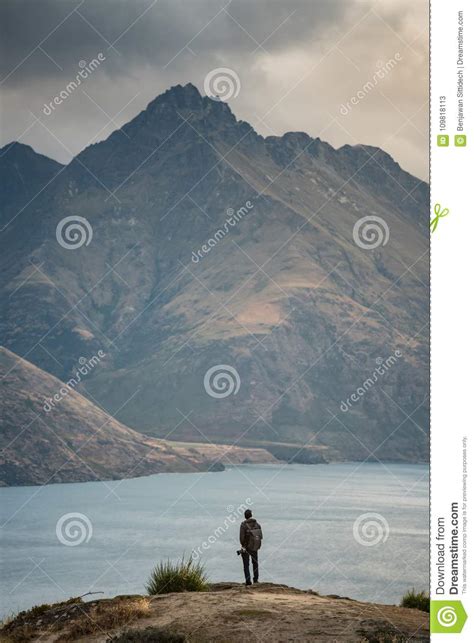 Young Asian Male Traveler With Mountain Scenery In Queenstown Stock